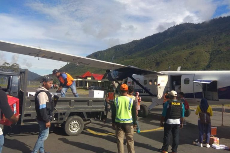 Air Freight Cargo Unloading at Remote Papua Airstrip