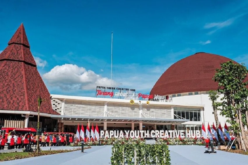 Papua Youth Creative Hub building with traditional-style roofs.