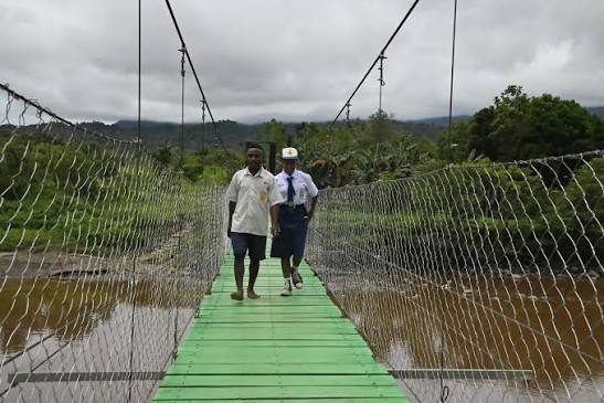 TNI personnel assisting civil infrastructure construction in rural Papua