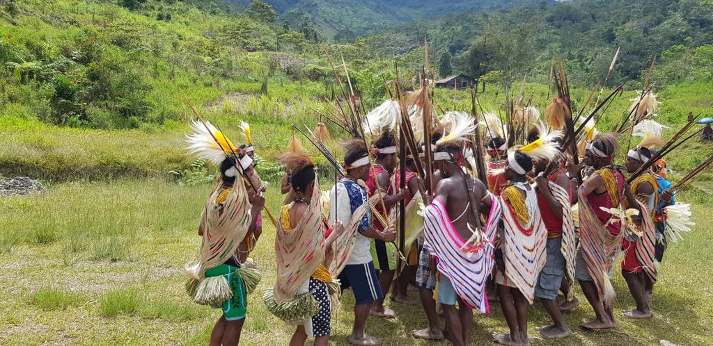 Local Papuan youth and community leaders working together on local development.