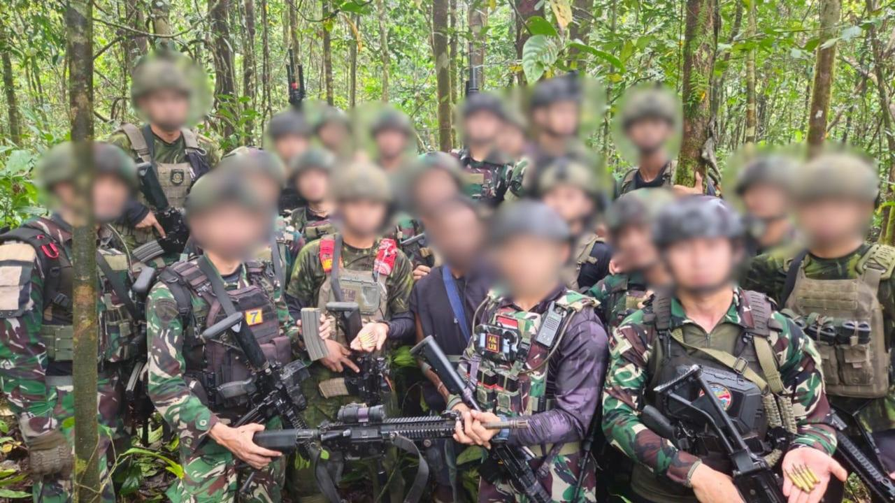 A joint military team in a forest in Maybrat, Southwest Papua, with faces blurred